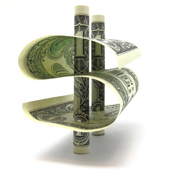 US Dollar bills forming the dollar sign